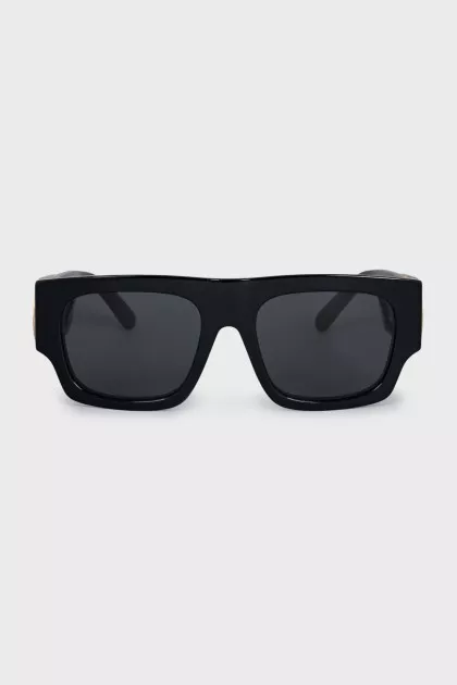 Black sunglasses with gold logo