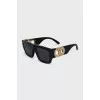 Black sunglasses with gold logo