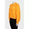 Orange sweatshirt with puff sleeves