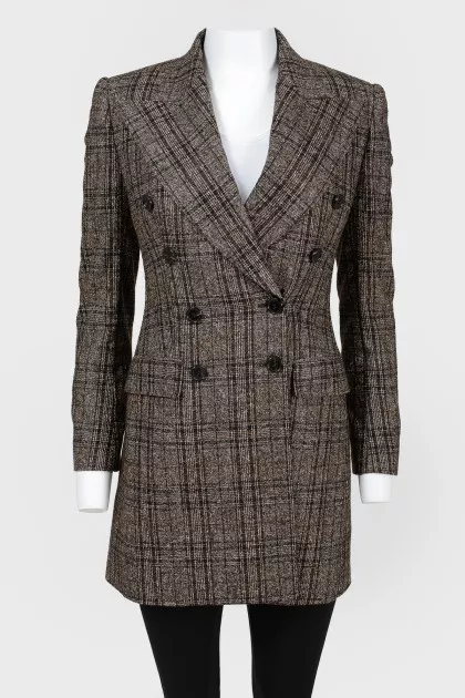 Double -breasted jacket in a cage with a tag