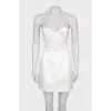 White mini dress with an open top