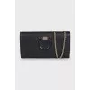 Leather crossbody bag with gold chain