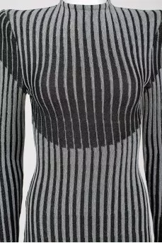 A tight-fitting-dress with a tag shoulders