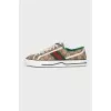 Brown sneakers with a signature print