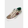 Brown sneakers with a signature print