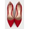 Red patent leather pumps