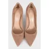 Beige suede pumps