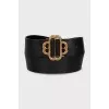 Black leather belt with a shaped buckle