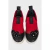 Red slip-ons with crystals