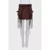 Denim skirt decorated with fringe