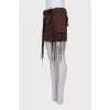 Denim skirt decorated with fringe