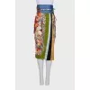 Silk skirt with a bright print and a belt