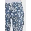 Jeans with perforations decorated with embroidery