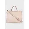 Leather bag with handle and strap