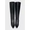 The boots are decorated with hooks