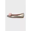 Silver ballet flats with a bow