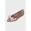 Silver ballet flats with a bow
