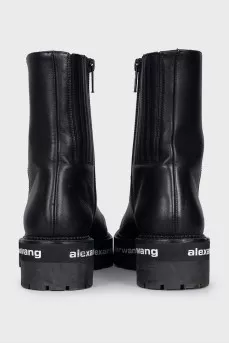 Leather boots with a logo on the sole