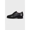 Men's leather shoes with perforations and laces
