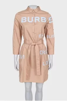 Dress with a buttoned patch pocket
