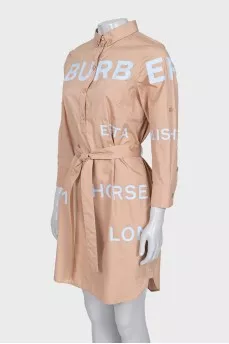 Dress with a buttoned patch pocket