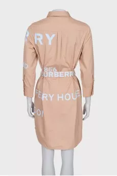 Dress with a buttoned patch pocket