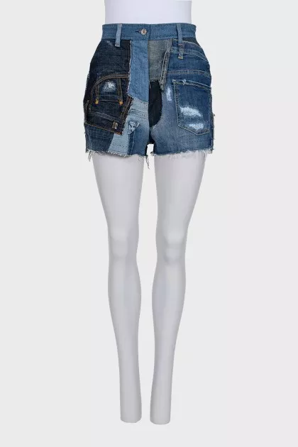 Blue denim shorts with a distressed effect