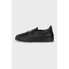 Men's leather slip-ons with a silver logo