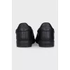 Men's leather slip-ons with a silver logo