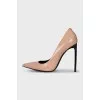 Beige leather pumps