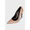Beige leather pumps