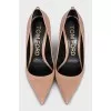 Beige leather pumps