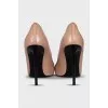 Beige leather pumps