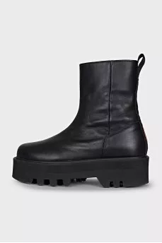 Black leather boots with a zipper