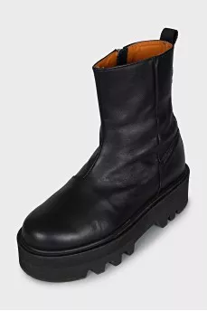 Black leather boots with a zipper