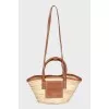 Raffia bag with leather inserts