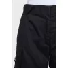 Wide black trousers with patch pockets