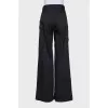 Wide black trousers with patch pockets