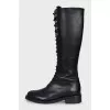Black boots with a zipper and laces
