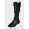 Black boots with a zipper and laces