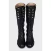Black boots with a zipper and laces
