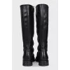 Black boots with a zipper and laces