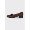 Brown shoes with a bow