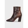 Animal print embossed ankle boots