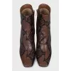 Animal print embossed ankle boots