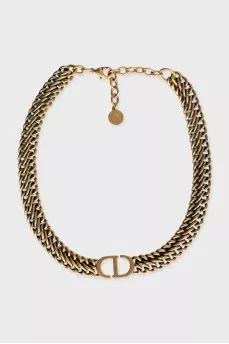 Gold choker with brand logo