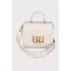 Leather bag with gold decor