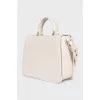 Leather bag with gold decor