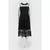 Dress with a transparent insert and feathers