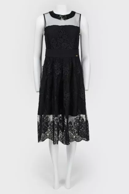 Dress with a transparent insert and feathers